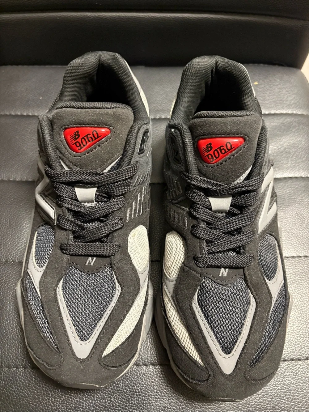 New Balance Kids Black and Gray Athletic Sneakers with Red Logo Accent